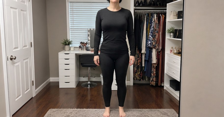 woman wearing black thermal underwear in a bedroom
