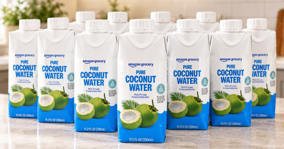 multiple bottles of Amazon Grocery Pure Coconut Water on kitchen counter