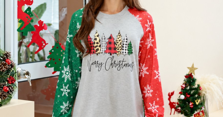 woman wearing a long sleeve christmas graphic shirt