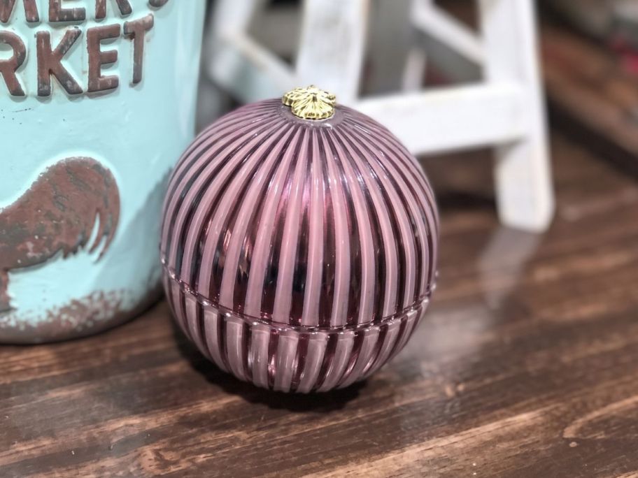 Better Homes & Gardens Glass Jar Candle in Cinnamon Stick on table