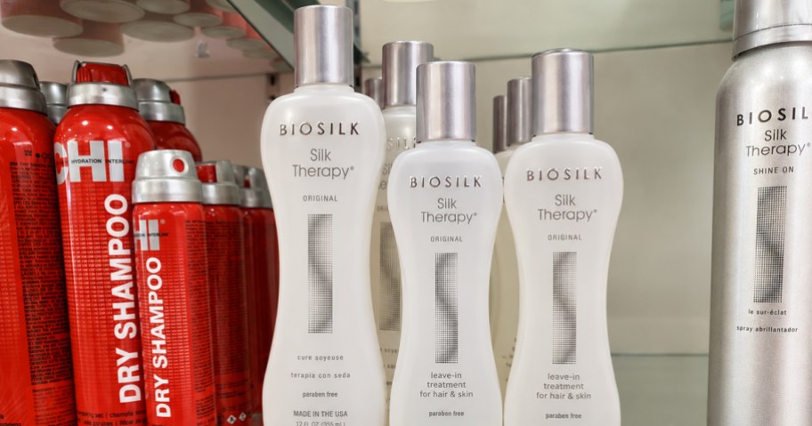 white bottles of BioSilk Leave-In Hair Treatment on store shelf