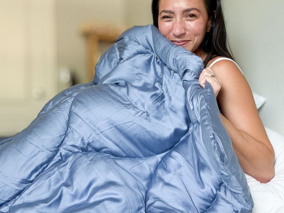 Woman with a blue Buffy Cloud Comforter
