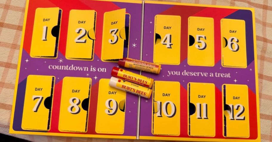 Burt's Bees Advent Calendar with some boxes open and 3 lip balms set on top