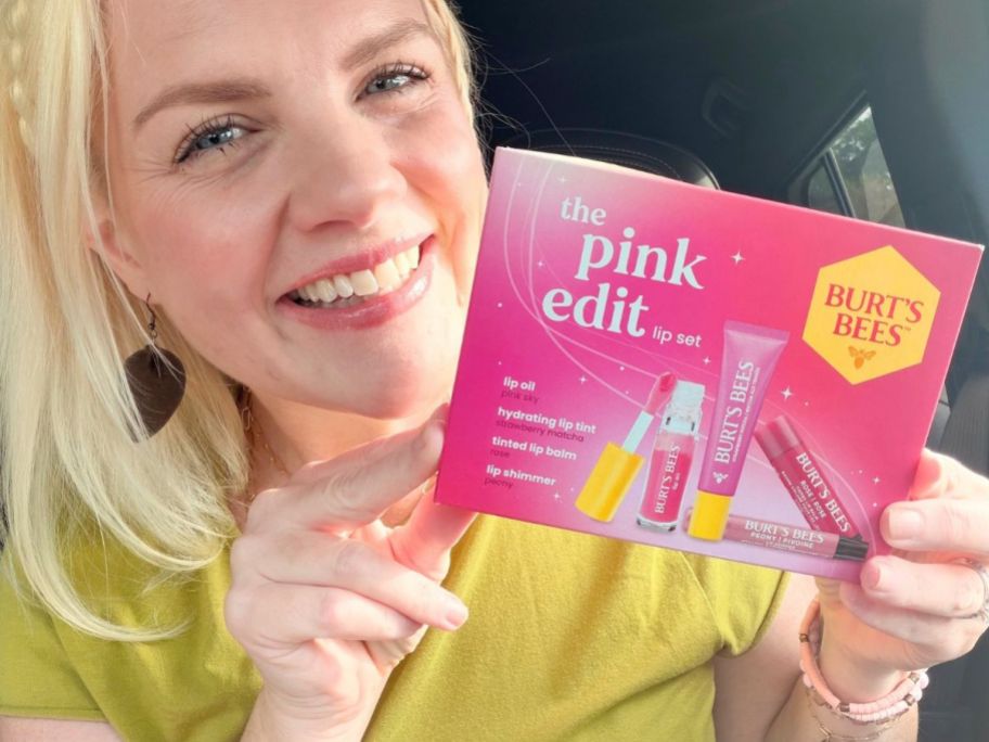 Woman holding a BUrt's Bees Pink Edit Lip Set