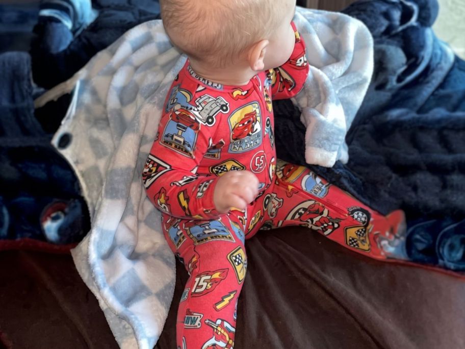 baby wearing cars Character Baby Sleep & Play Footed Pajamas in crib