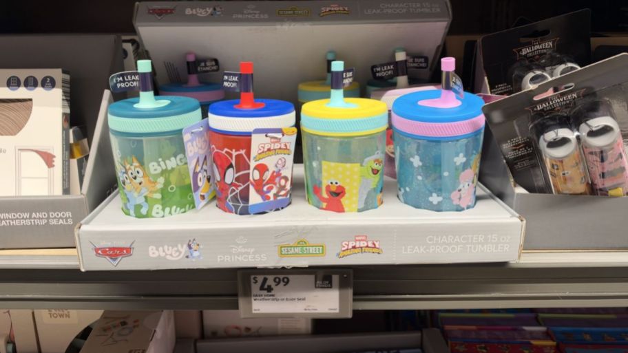 Character sippy cups on top of the table