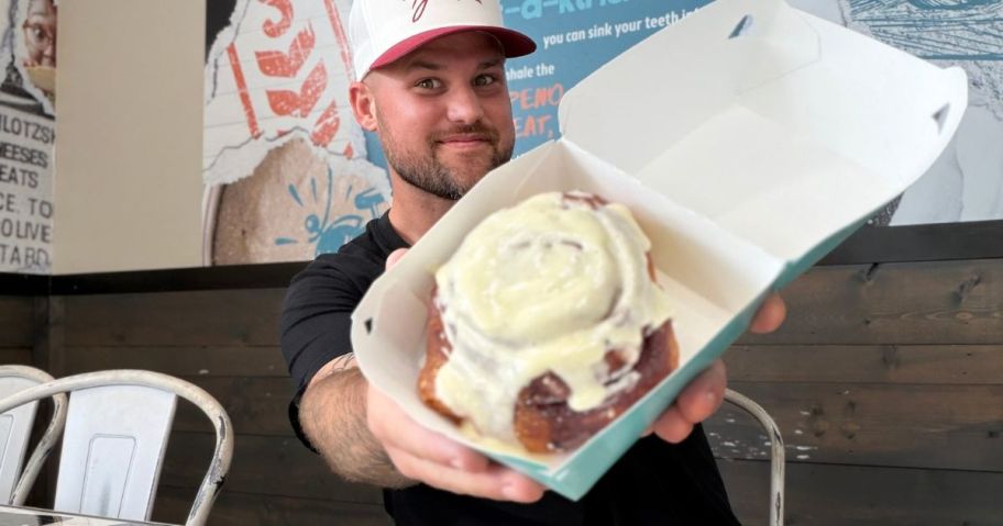 Stetson holding a Cinnabon in store
