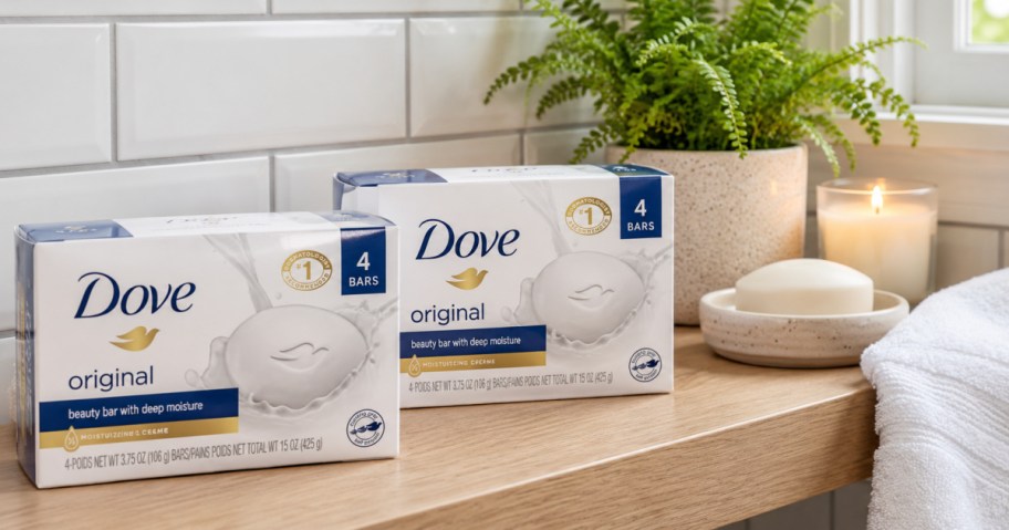Two boxes of dove bar soap on wooden countertop in bathroom