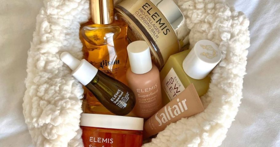 A sherpa pouch filled with Elemis Skincare and other beauty products