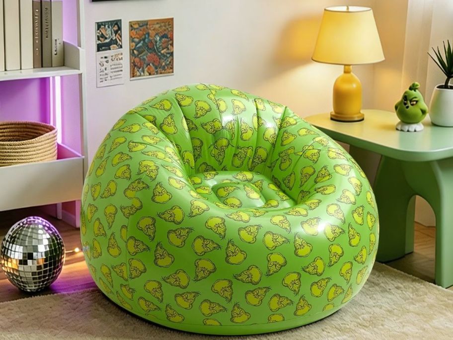 Grinch inflatable chair displayed in a bedroom