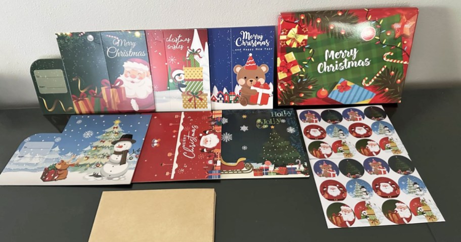christmas cards and stickers on a table