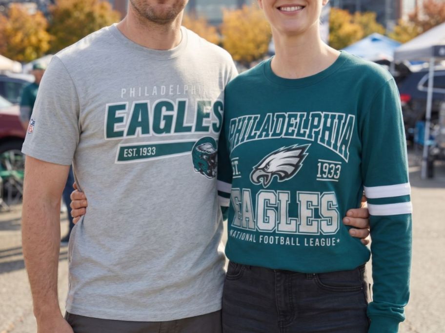 A man and a woman wearing NFL Philadelphia Short and Long-Sleeve T-Shirts