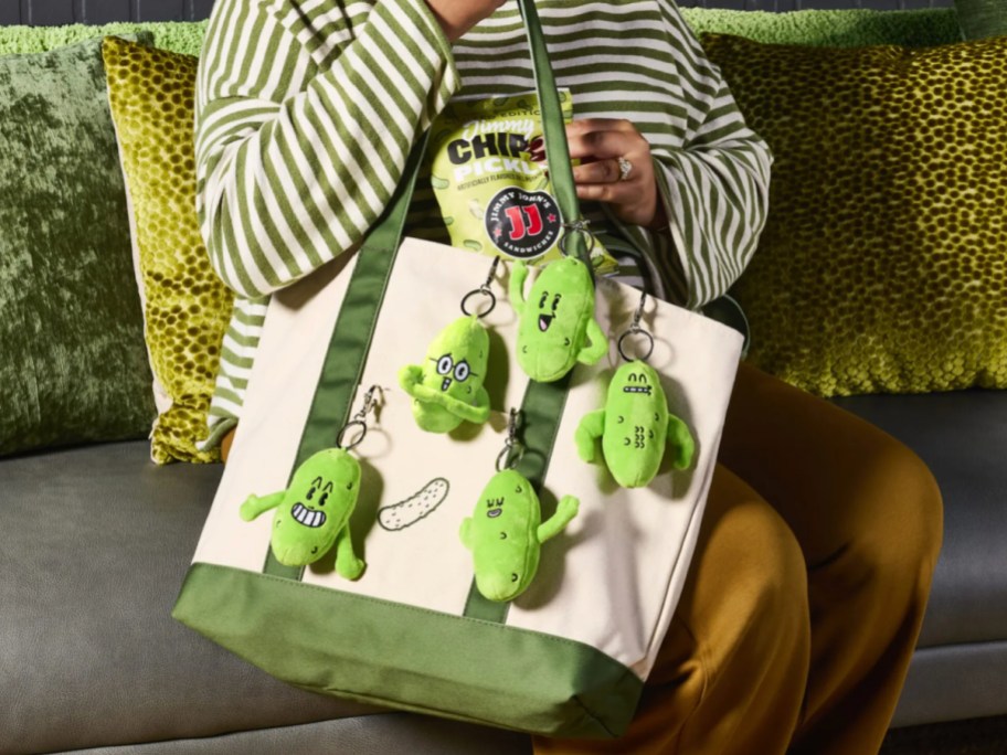 Jimmy Johns Mystery Pickle Plushies hanging off canvas bag