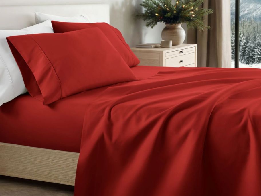 Linens & Hutch Red Holiday Sheets on a bed