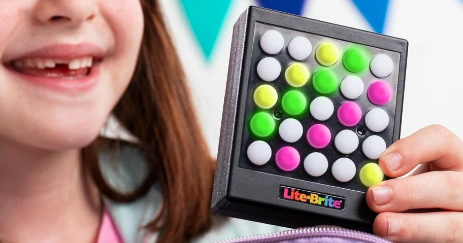 girl holding a Lite Brite Touch Mini