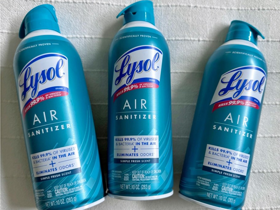 three blue cans of Lysol Air Sanitizer Spray