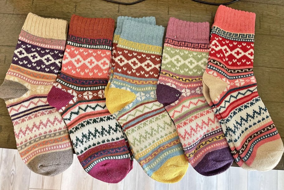 colorful pairs of wool socks in a row