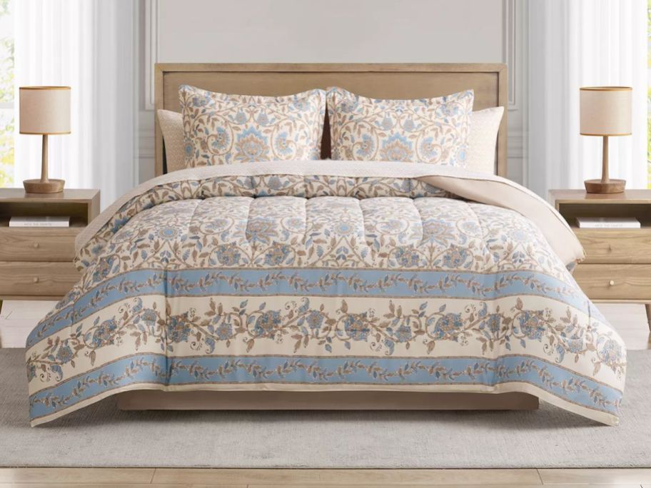 Stock image of a bed with a Macy's 8-piece comforter