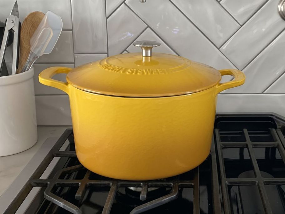 yellow Martha Stewart Gatwick Ombre 7-Quart Enameled Cast Iron Dutch Oven on stove