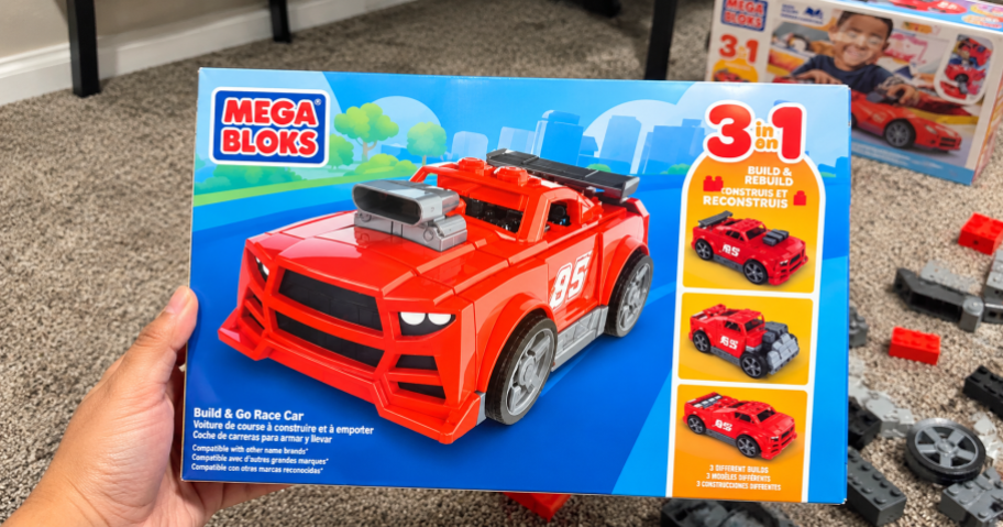 hand holding mega bloks truck set