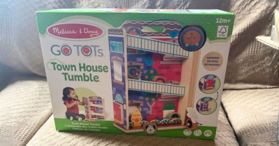 Melissa & Doug GO TOTs Town House Tumble box on couch