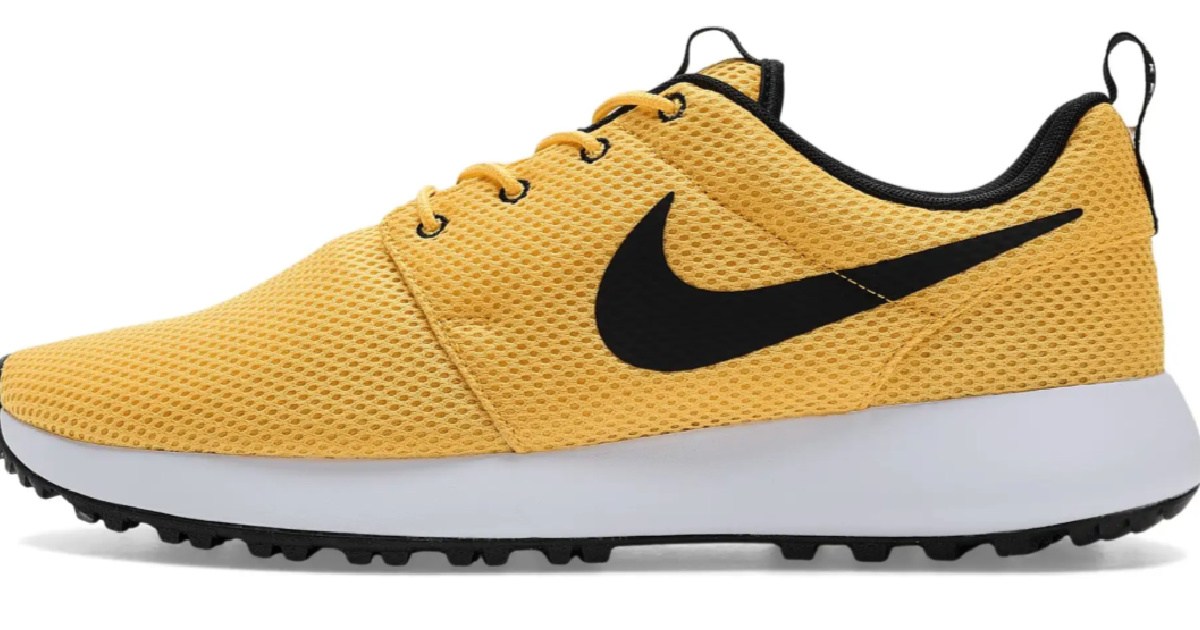 Gold, black, and white Nike golf shoe