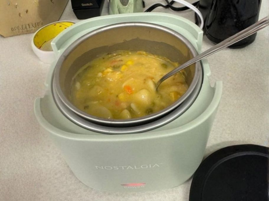 Nostalgia Electrics 20oz Portable Heated Lunch Box with soup in it