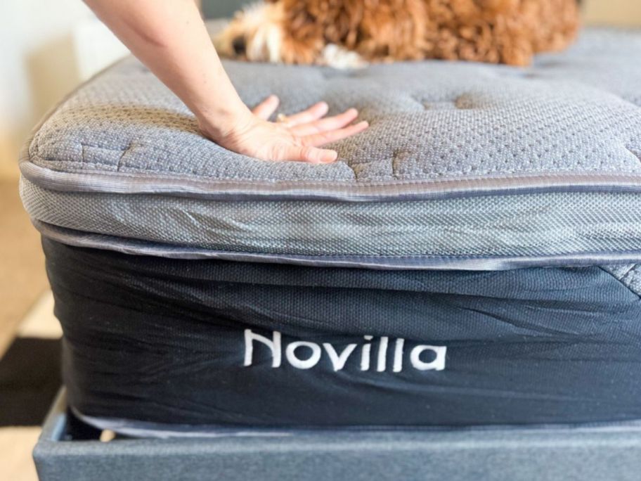 hand pressing on a Novilla Mattress