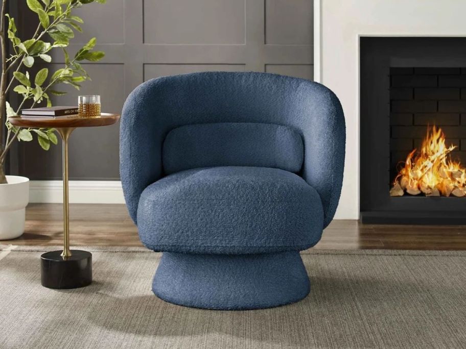 Orren Ellis Saboor Swivel Accent Chair in living room