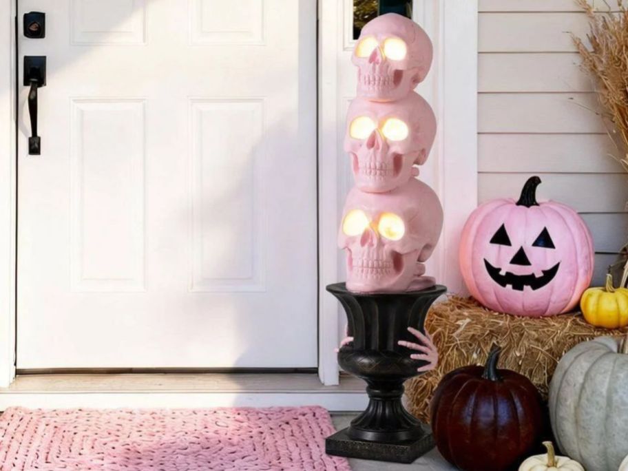 Pink skulls and urn displayed outside