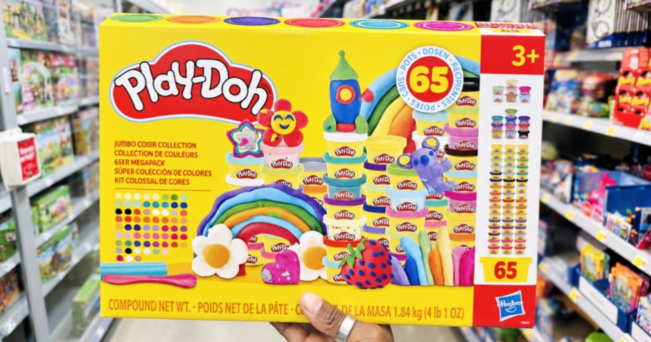 hand holding up yellow Play-Doh 65-Count Jumbo Color Collection box in store