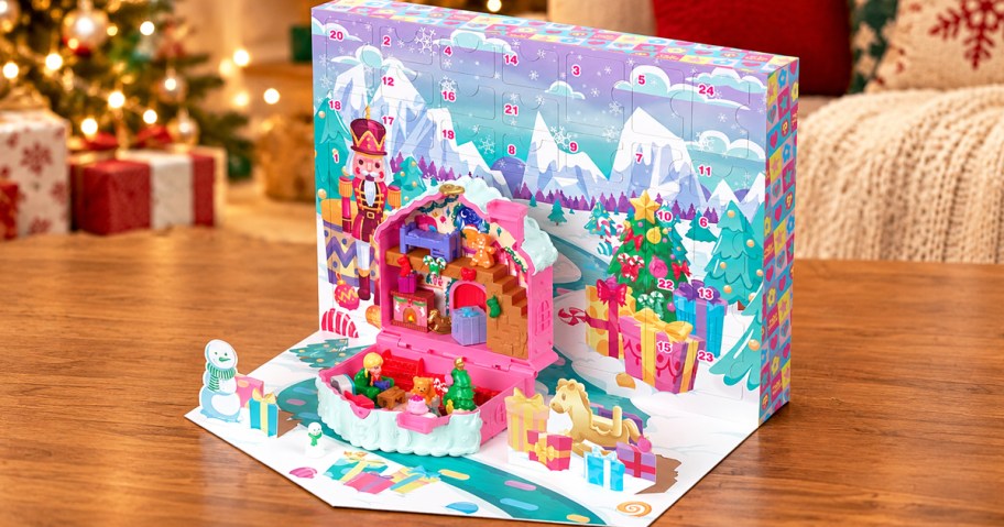 Polly Pocket Advent Calendar on a table with christmas tree in background