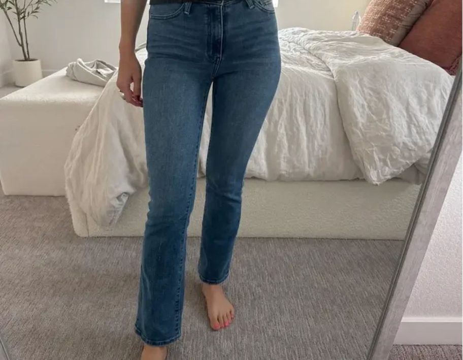 woman wearing Quince Bella Kick Jeans