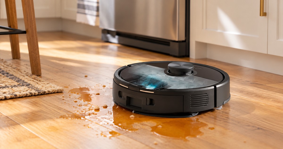 Robo rock vacuum mop cleaning up spill on hardwood floors in kitchen