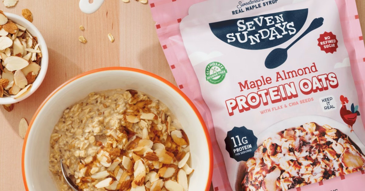 Bag of maple almond protein oatmeal next to bowl of oatmeal on kitchen tabletop