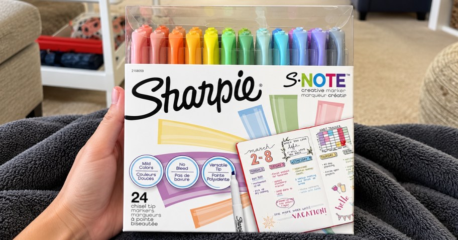 hand holding up a pack of Sharpie S-Note Pastel Markers