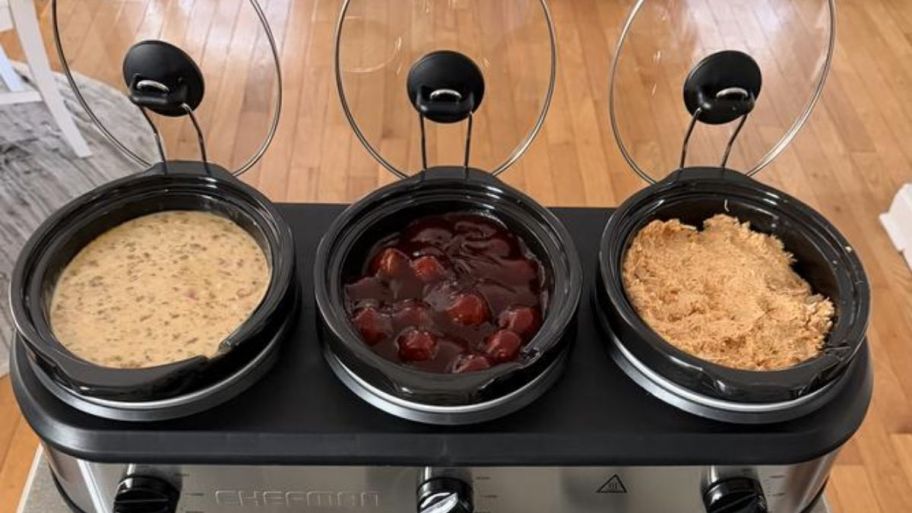 Slow-cooker-and-buffet on top of the table with food