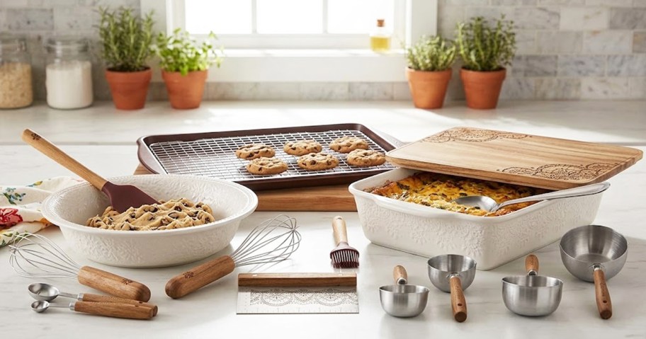 the pioneer woman ceramic baking set with pans and baking utensils spread out on countertop