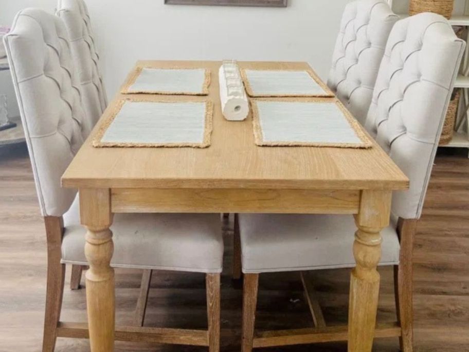 Three Posts Baril Solid Wood Farmhouse Dining Table in dining room