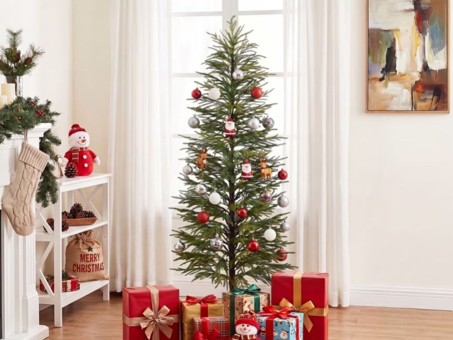Unlit Christmas tree with gifts underneath