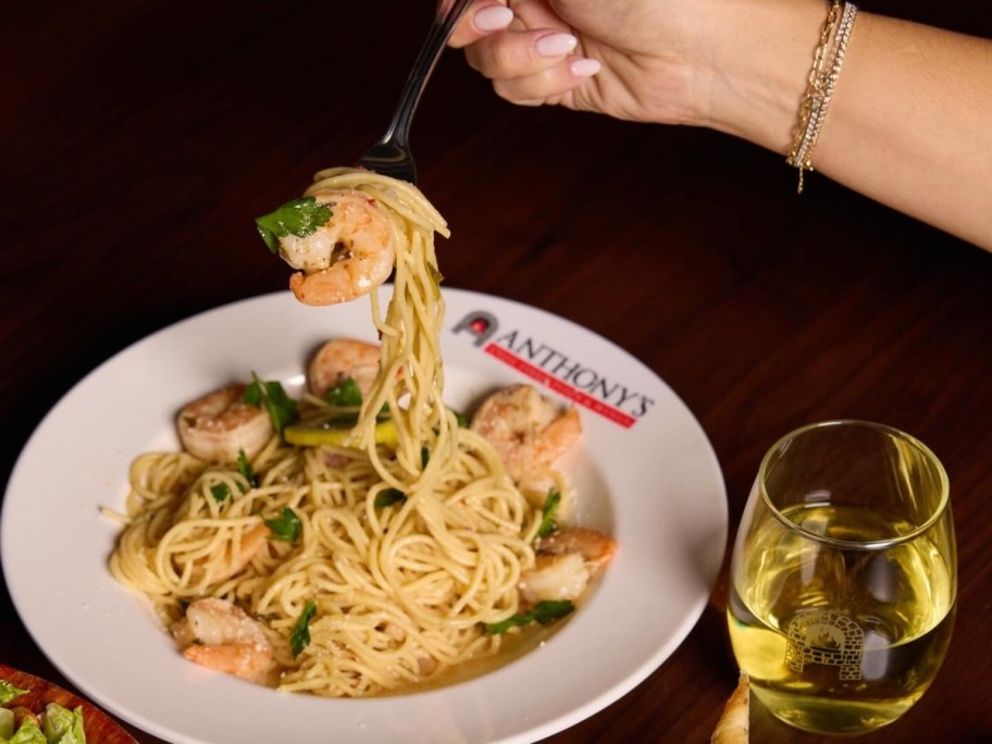 lifting a fork full of pasta and shrimp