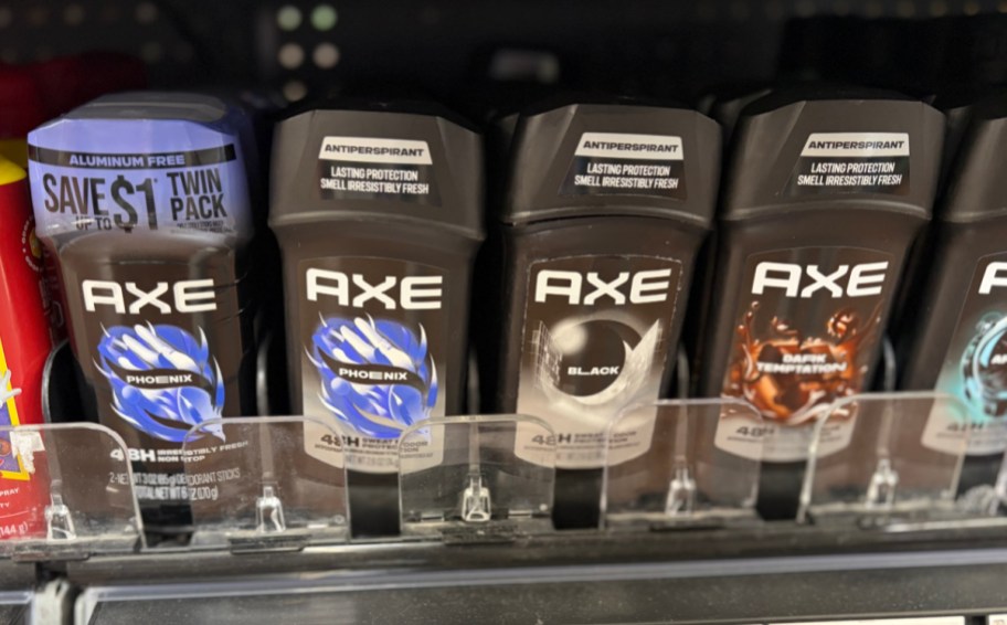 axe stick deodorants lined up on a store shelf