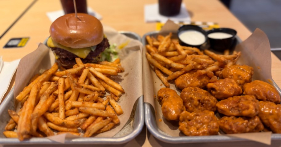 Two Buffalo Wild Wings meals on trays at the restaurant.