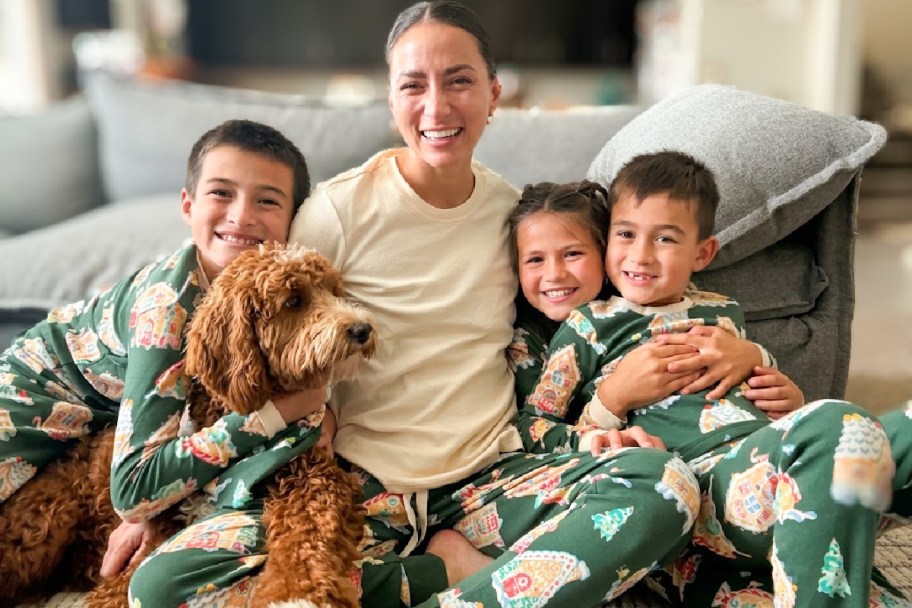 mom and kids and dog in holiday pajamas