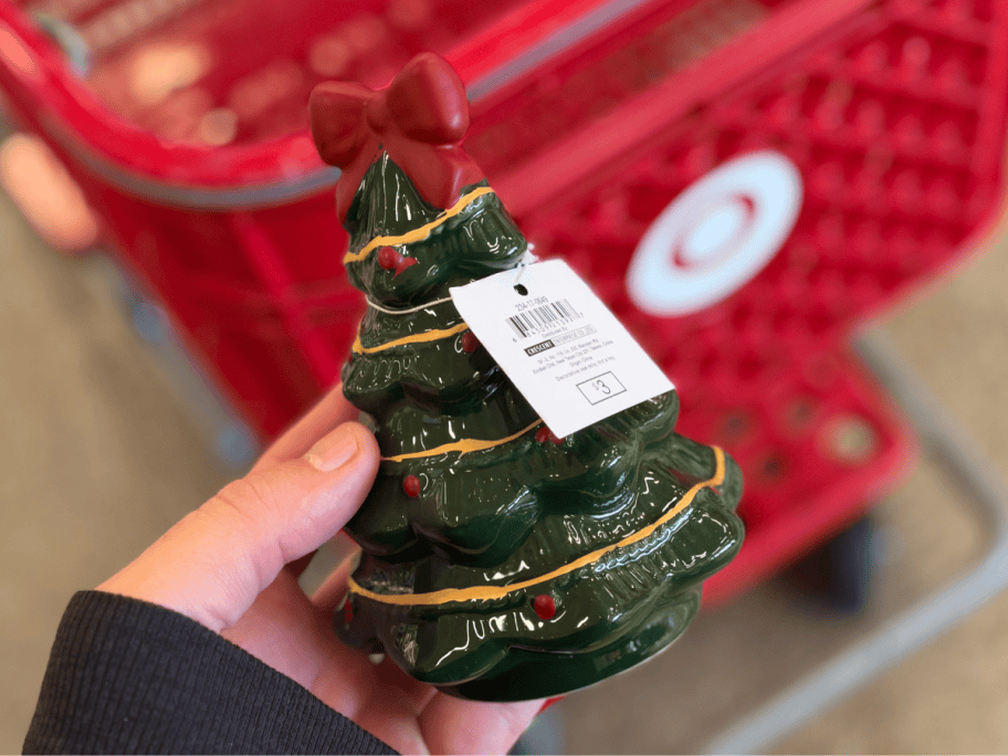 hand holding green ceramic christmas tree