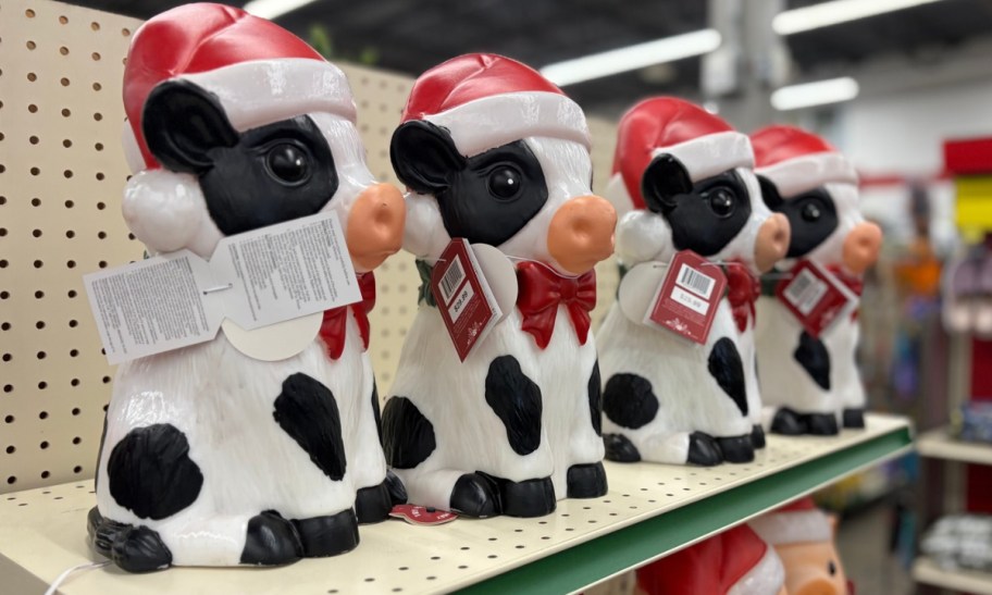 led milk cow blow molds on a store shelf