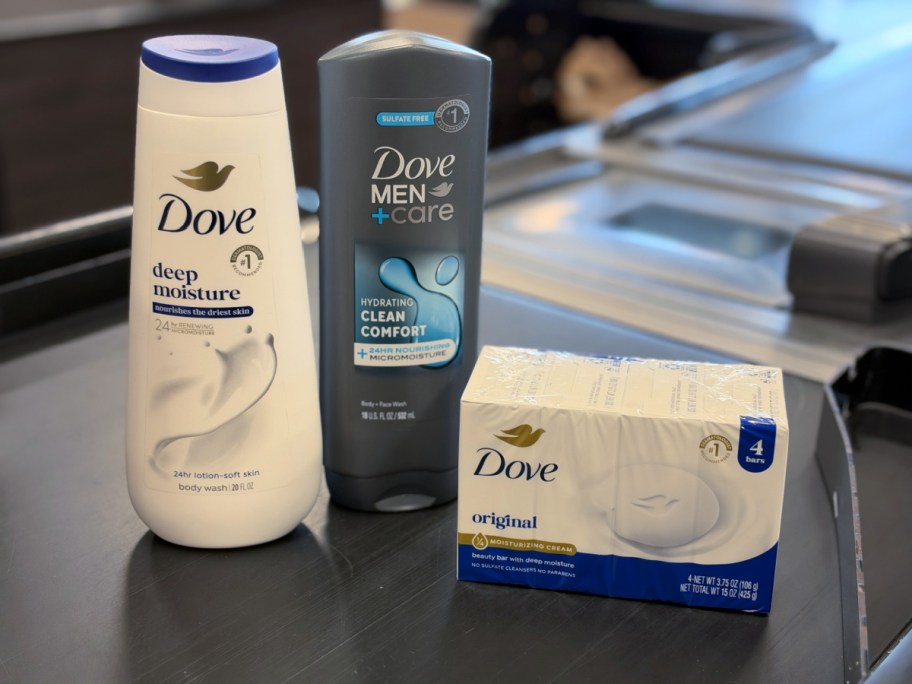 dove body wash and soap on a store checkout conveyor