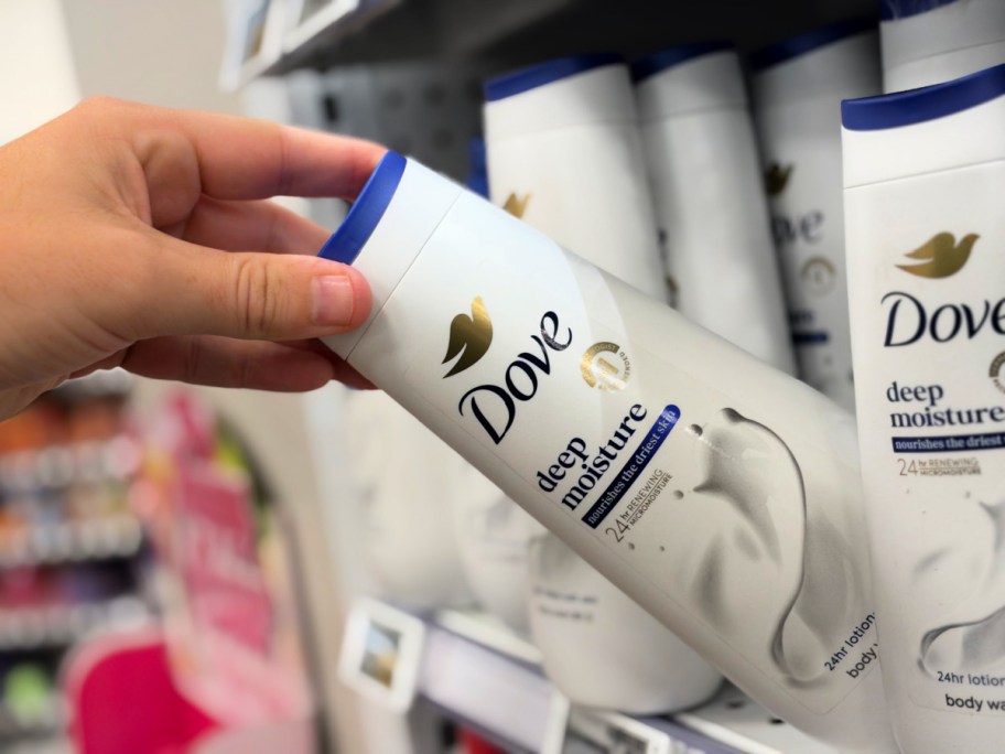 hand pulling dove body wash off a store shelf