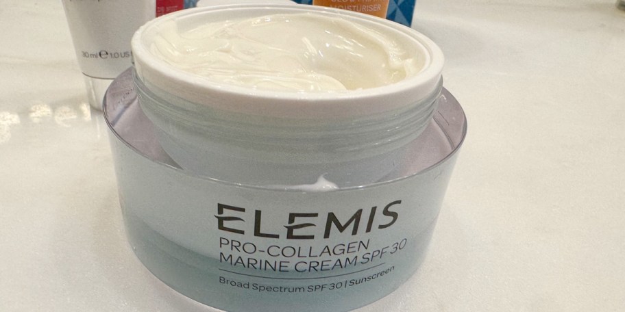 elemis collagen cream jar open on table
