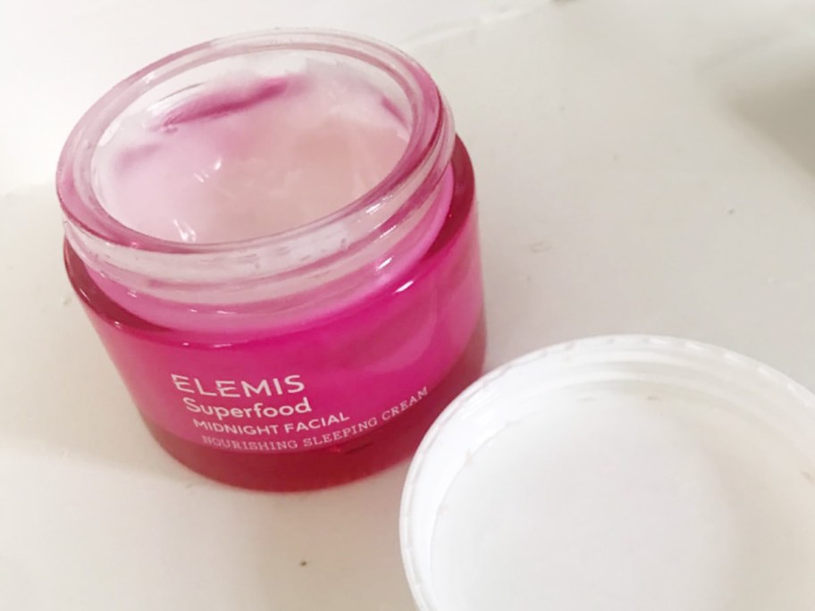 elemis pink jar open on table 